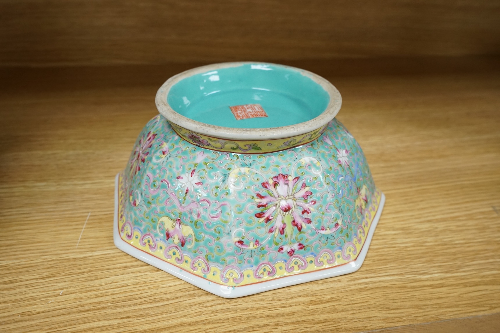A Chinese enamelled porcelain turquoise ground hexagonal dish, Qianlong mark, late 19th century, 21cm in diameter